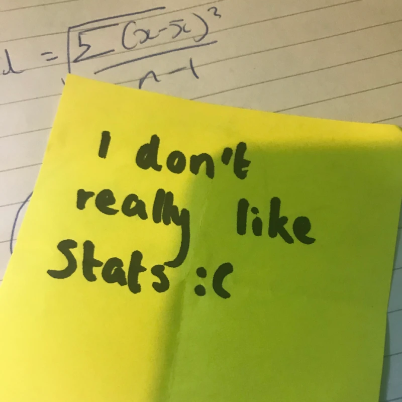 Image shows a post it with the words. I don't really like stats over notepaper with maths formulae. Student feedback which inspired the project- How to do statistics.