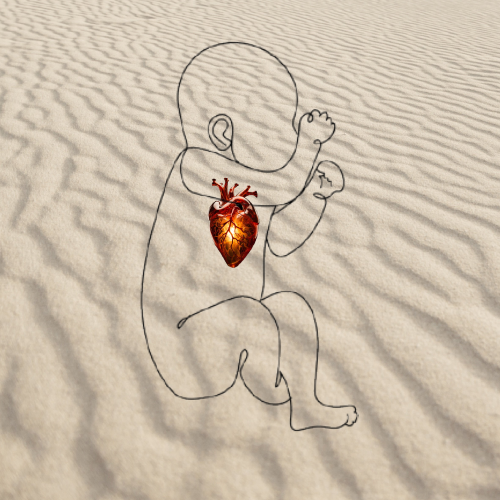 Outline of baby on sand with glass heart inside